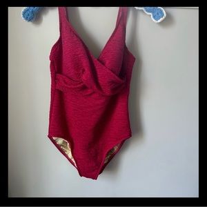 One piece raspberry colored bathing suit